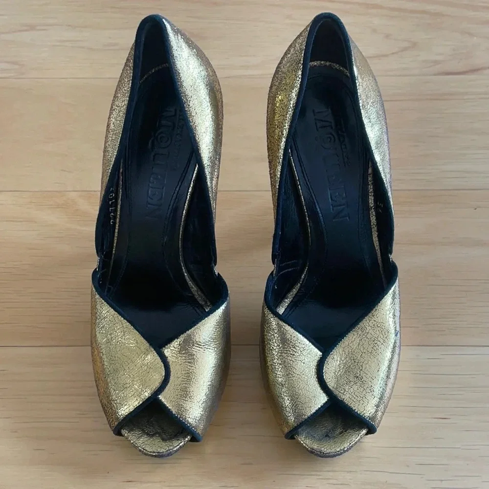 Alexander McQueen gold and black peep toe stilettos